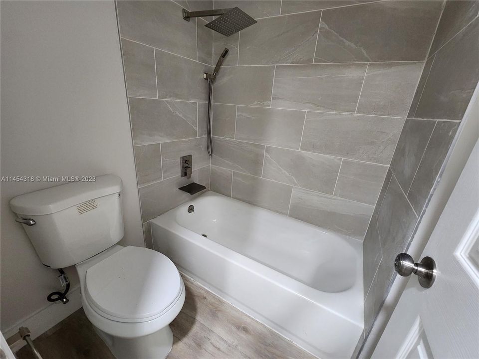 New bathroom with rain shower and tub