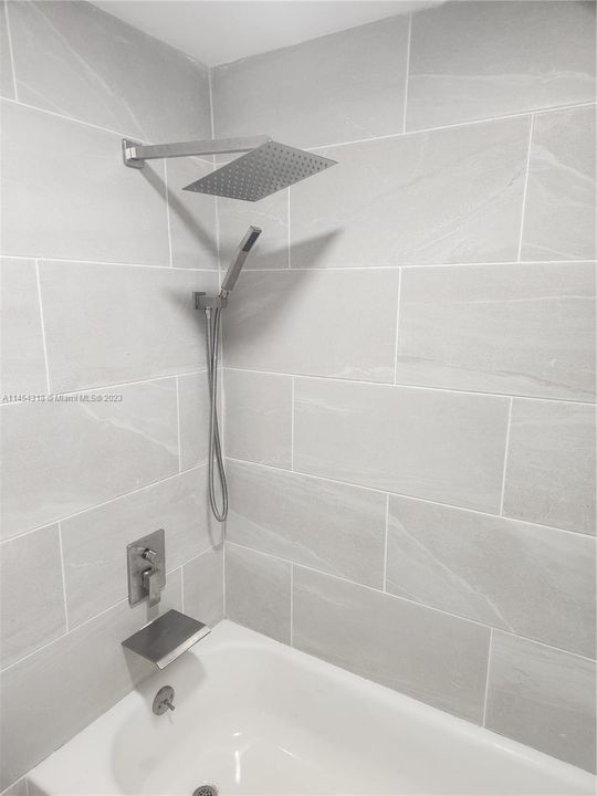 large neutral tiles in bathrooms