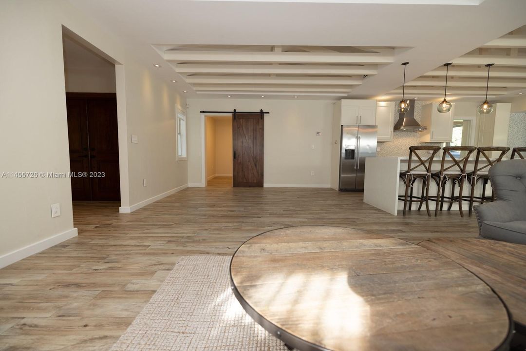 Barn door is the entrance for the bonus room with private bath.