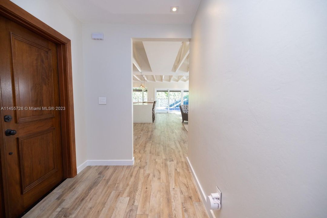 Turn left to the main living and right to the master ensuite and two bedrooms, plus second bath.