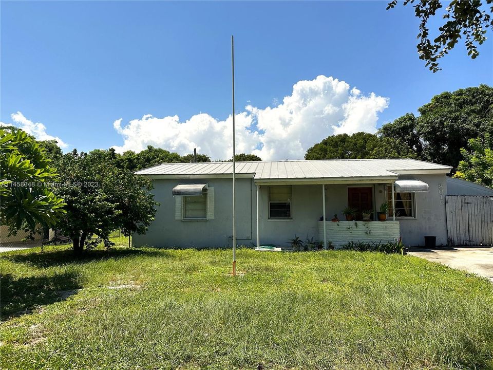 Front - lovely neighborhood, good size yard with fruit trees and partial fence.
