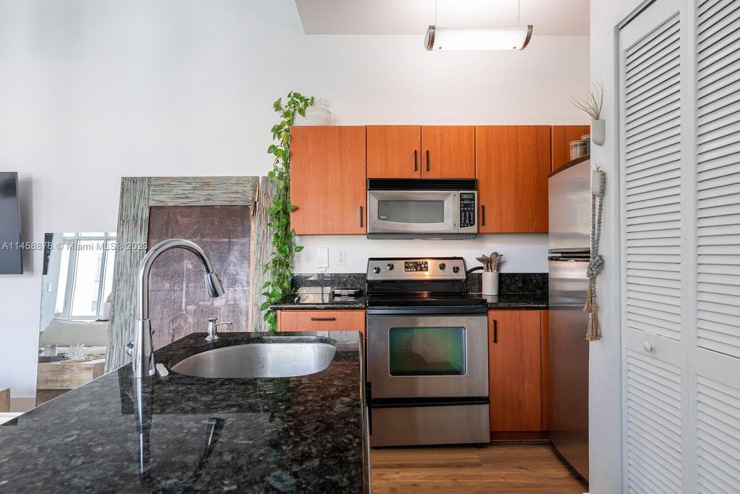 includes washer/dryer