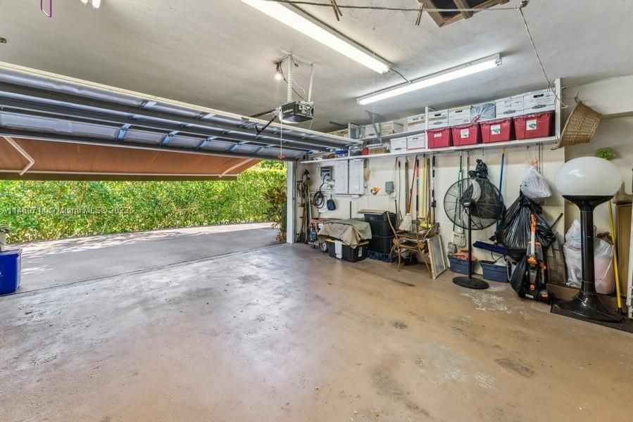 Full 2Car Garage with storage shelves, Generator connector with a separate control panel to run the house off the Generator..