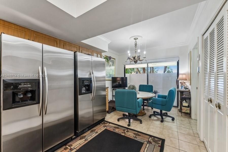 This shows the double refrigerators and the breakfast area overlooking a Lani.