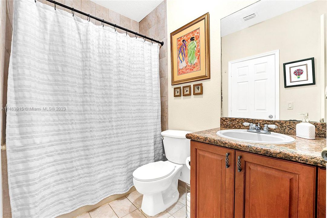 Combination bath tub and shower with linen closet