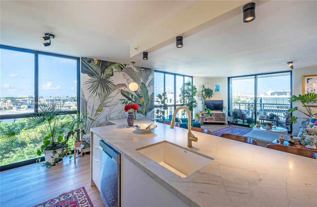Renovated open kitchen with quartzite counters