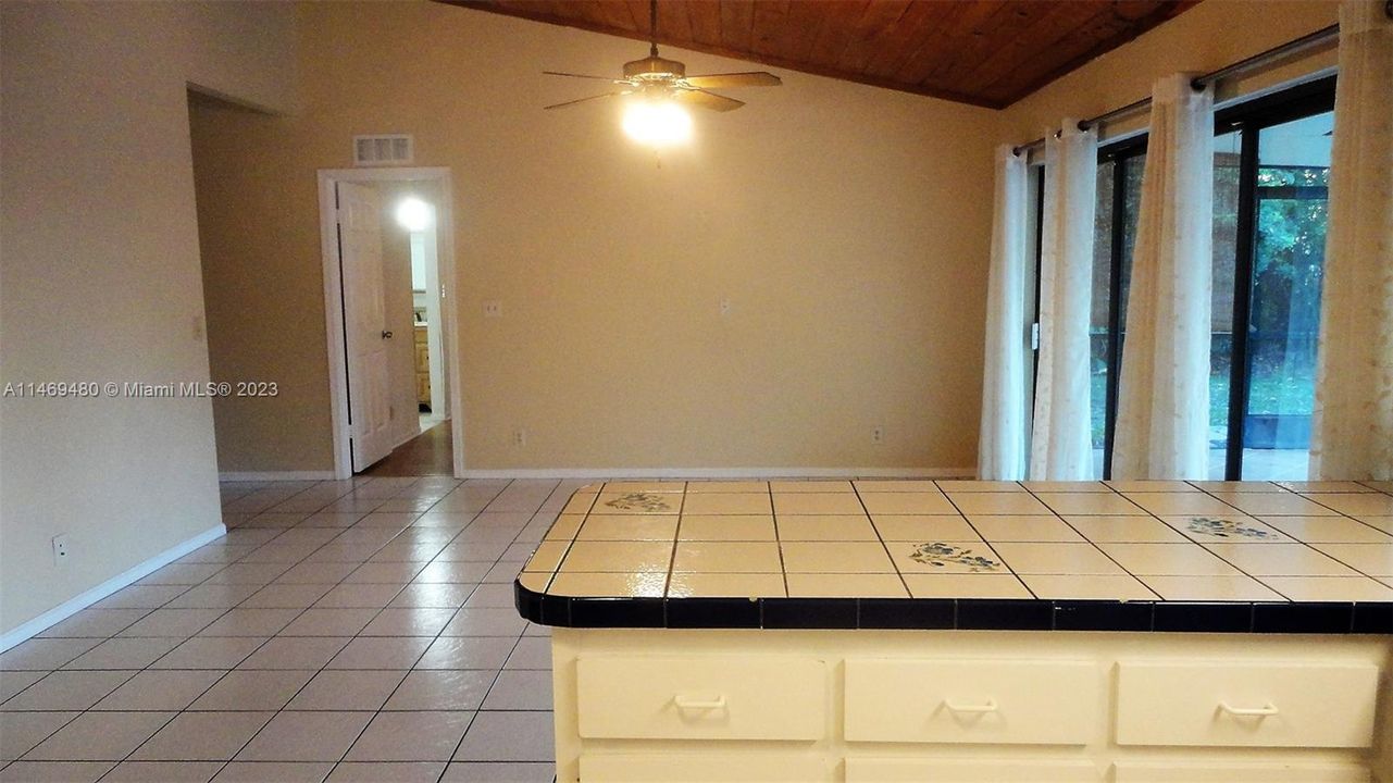 Kitchen with vaulted wood ceiling