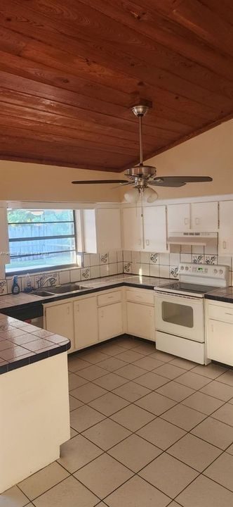 Kitchen w. Vaulted Wood Ceiling