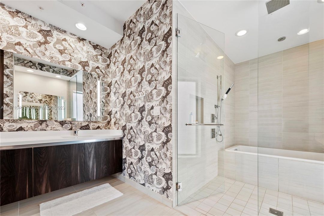 Primary Bathroom with Glass Enclosed Shower + Tub