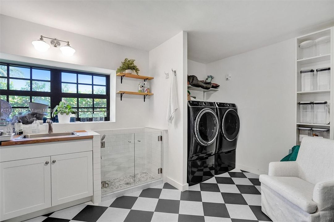 HUGE hidden pantry with Private laundry area, pantry, dog washing station, coffee station, sink & extra refridgeration.