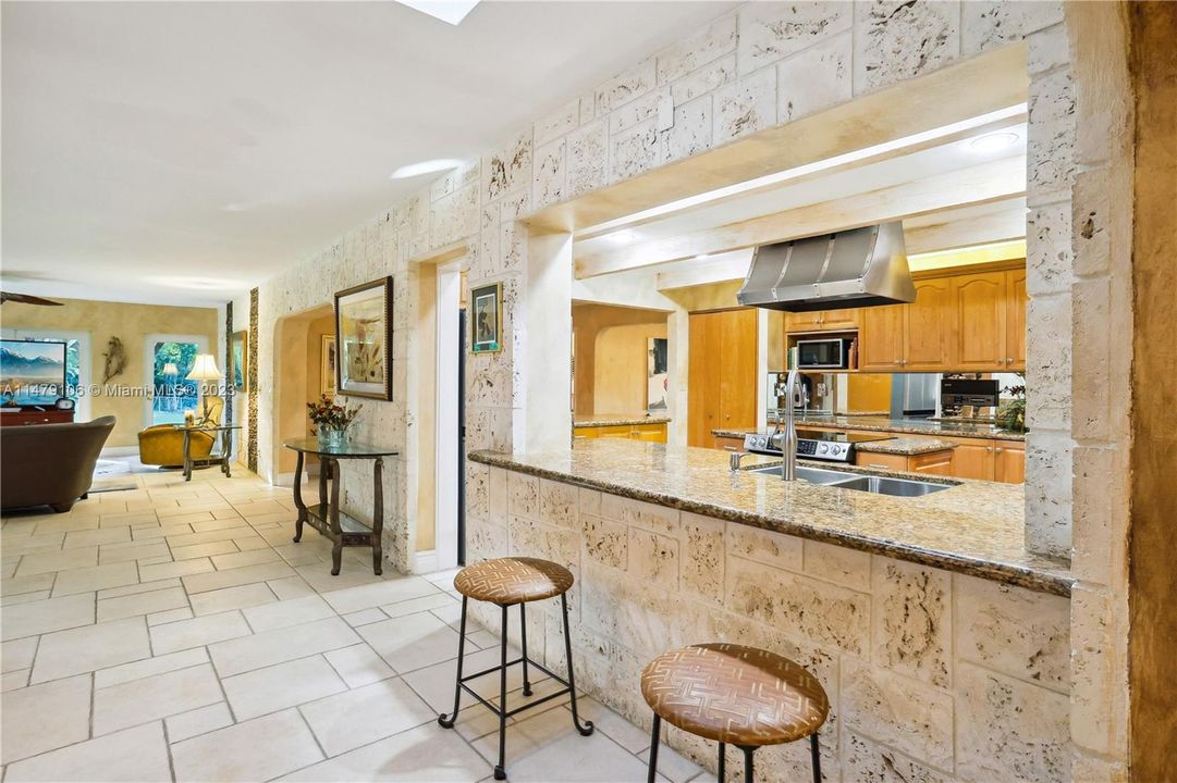 See the gorgeous coral stone framing the kitchen