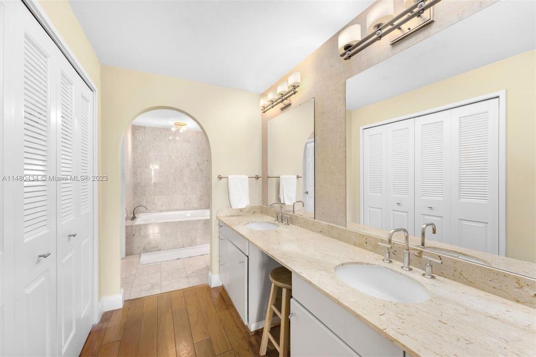 Large primary bathroom has separate soaking tub and shower