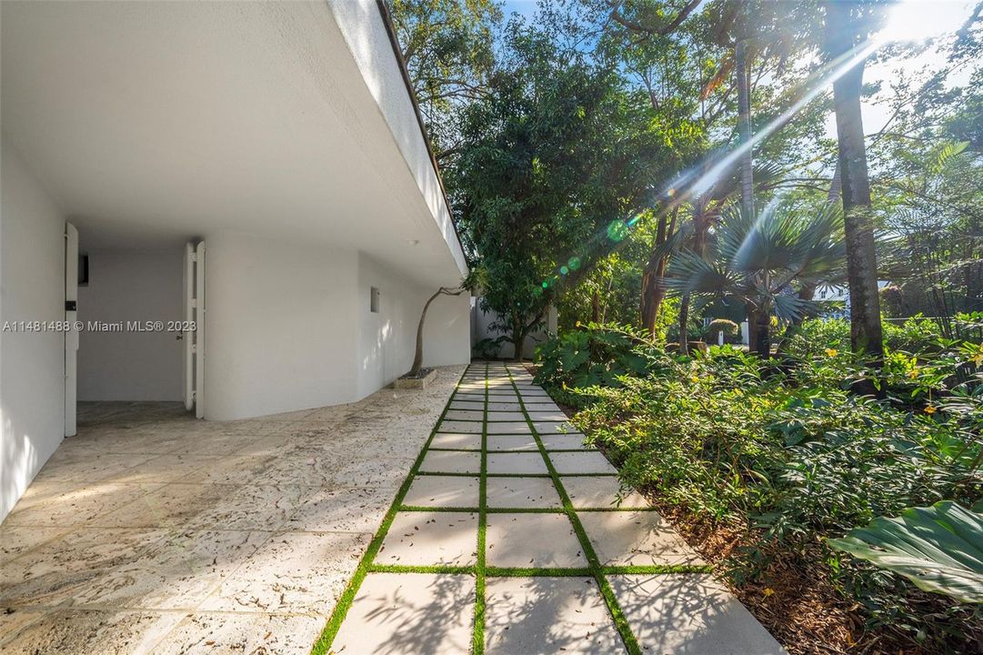 Pool is privately set amongst lush tropical foliage