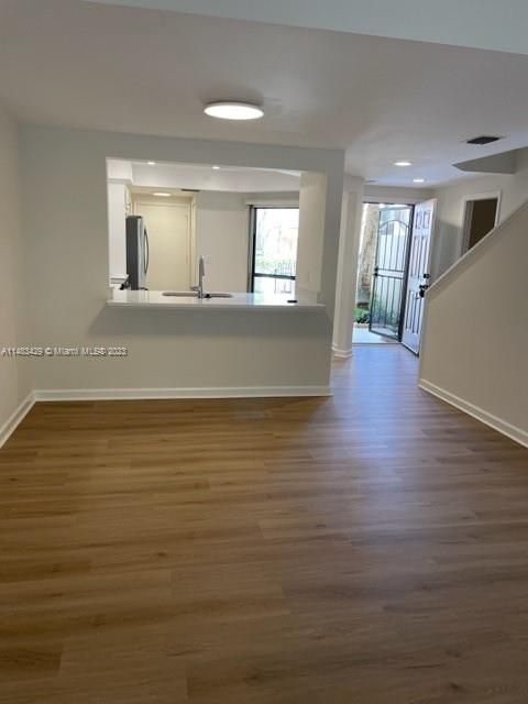 View to kitchen and front door from living room