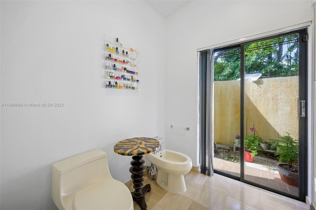 Private area within the main bathroom with water closet and bidet