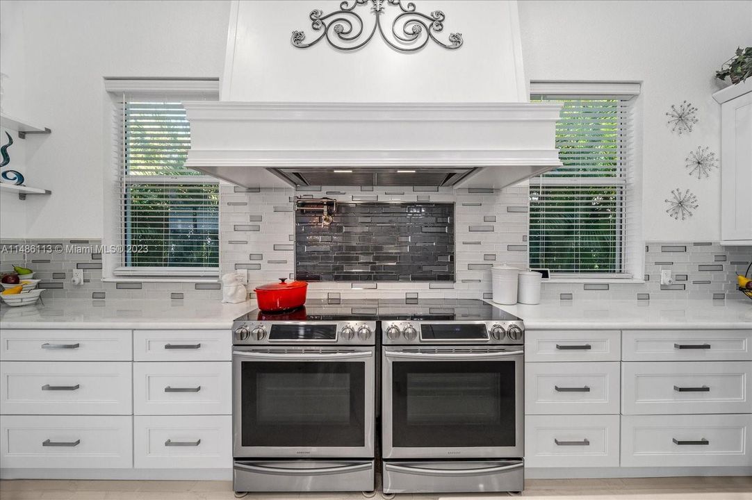 TWO ovens with induction cooktops