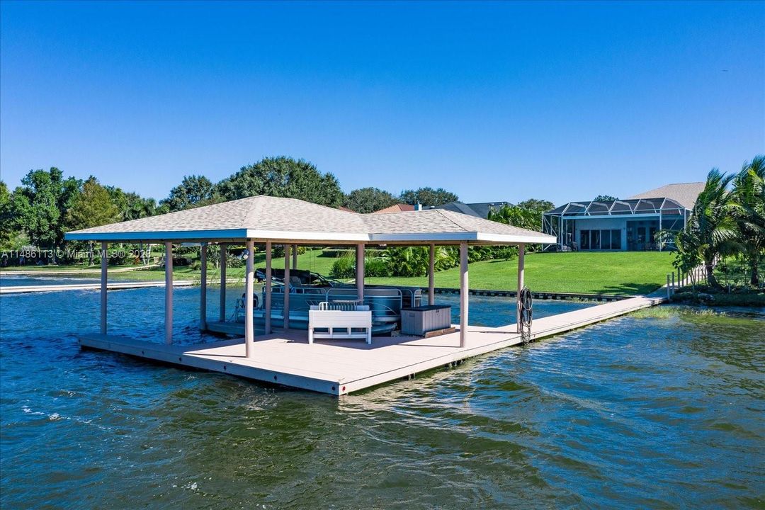 Keep your boat under your private boathouse with lift.