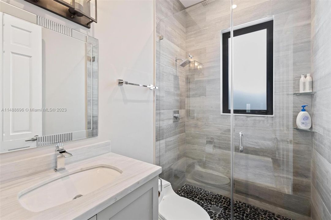 Downstairs bathroom adjacent to bedroom