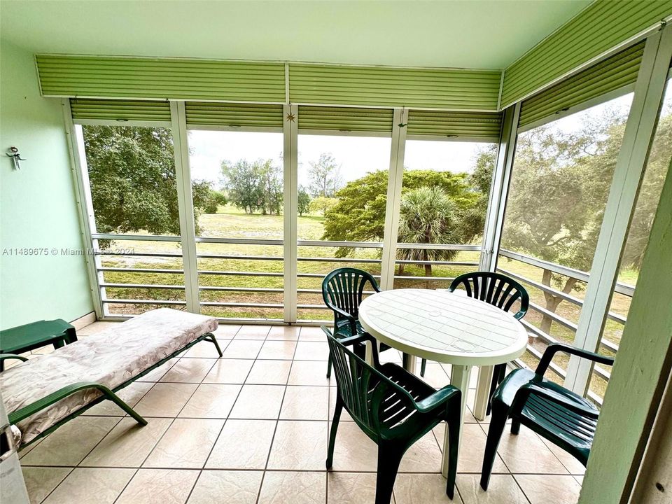 Screened balcony is a perfect spot for relaxing anytime.