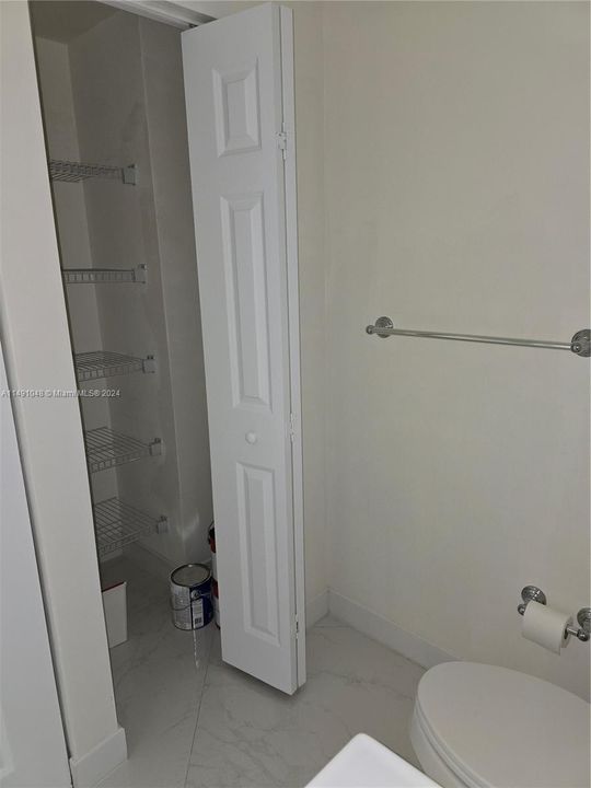 Utility closet in downstairs bathroom