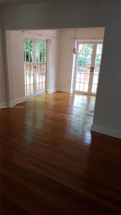 Dining area with 2 walls of French doors opening to deck