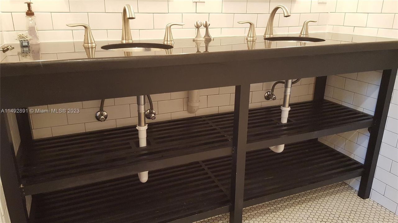 Master custom vanity with black granite