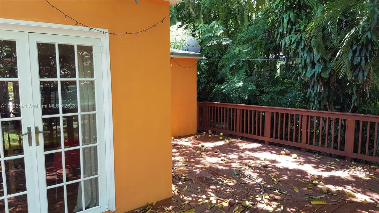 Deck looking S-West past dining room French doors