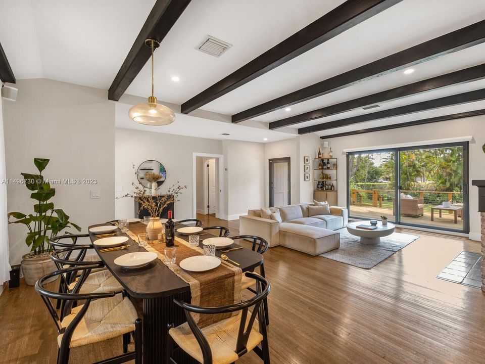 Open Flow Living & Dining with Wood Beamed Ceilings