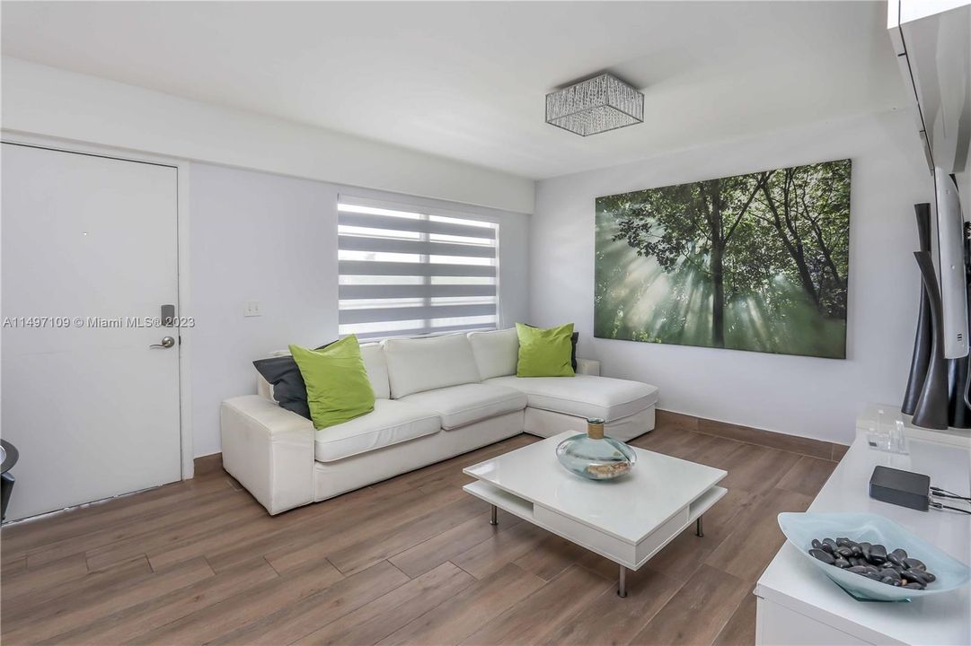 Living Room with Modern Light Fixture!