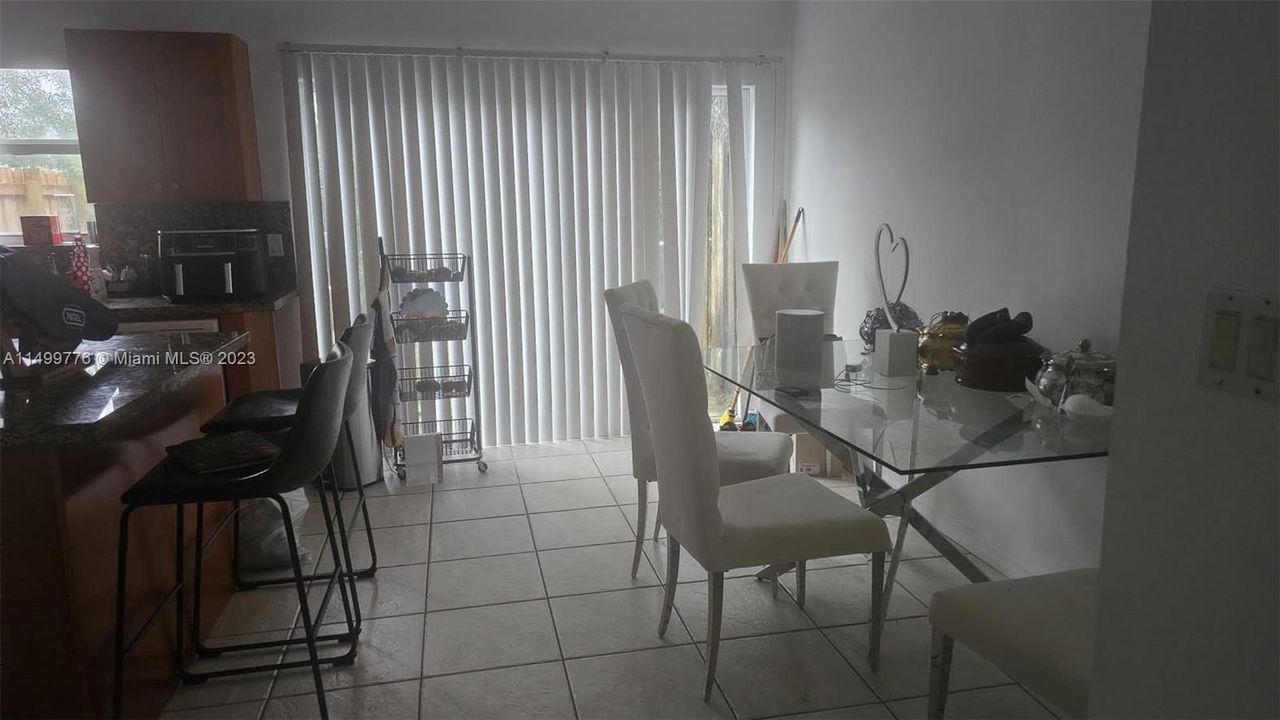 Dining area with kitchen island seen