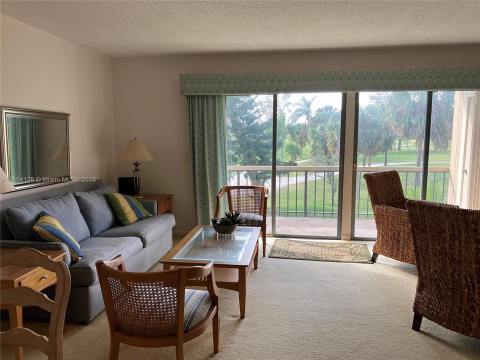 Large living area with private balcony overlooking the 7th green