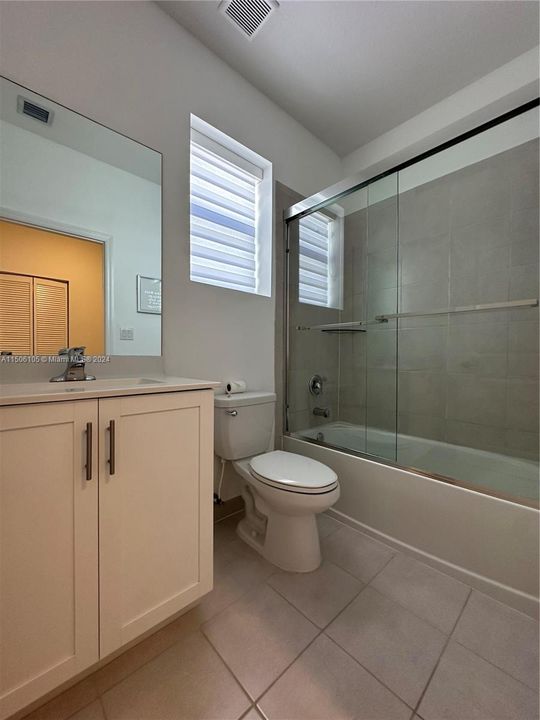 2nd Bath w/tub and glass enclosure.