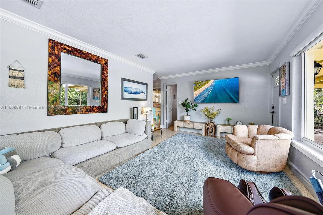 lots of light from impact windows. Terrazzo flooring.