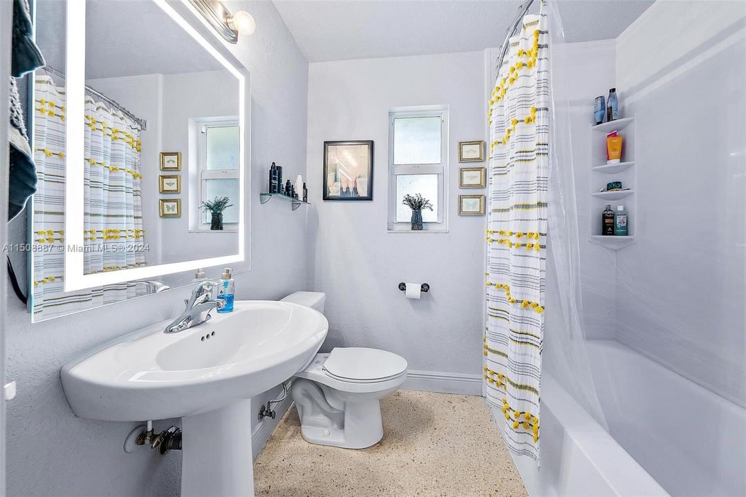 full bath with tub/shower combo.