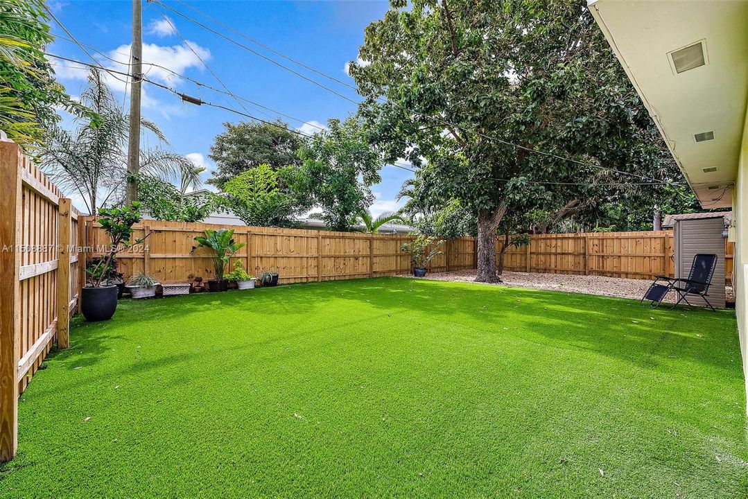 Low maintenance yard with turf and stone. Private fully fenced in yard.