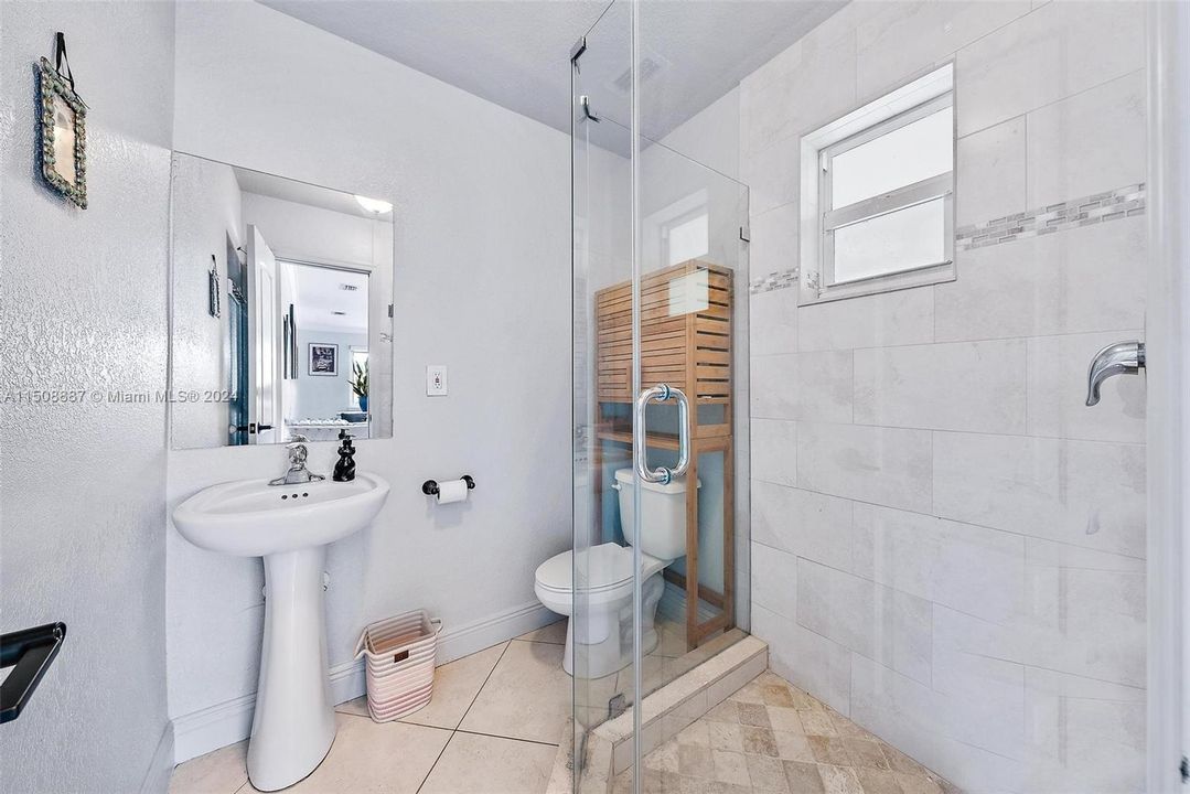 Full bath with walk in shower.