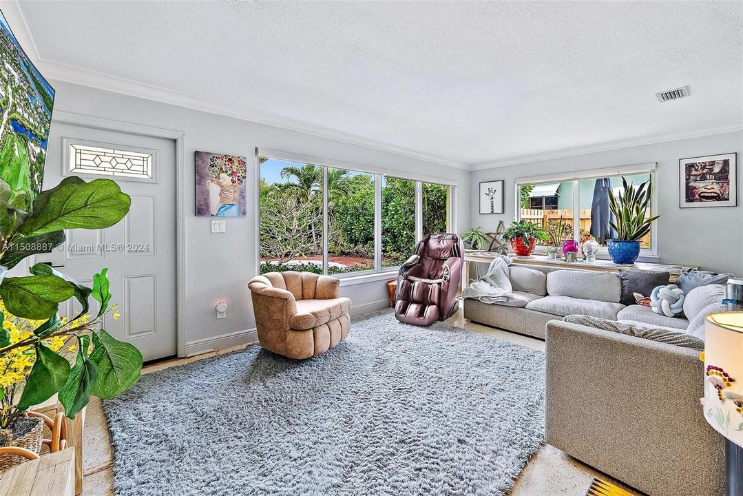 lots of light from impact windows. Terrazzo flooring.