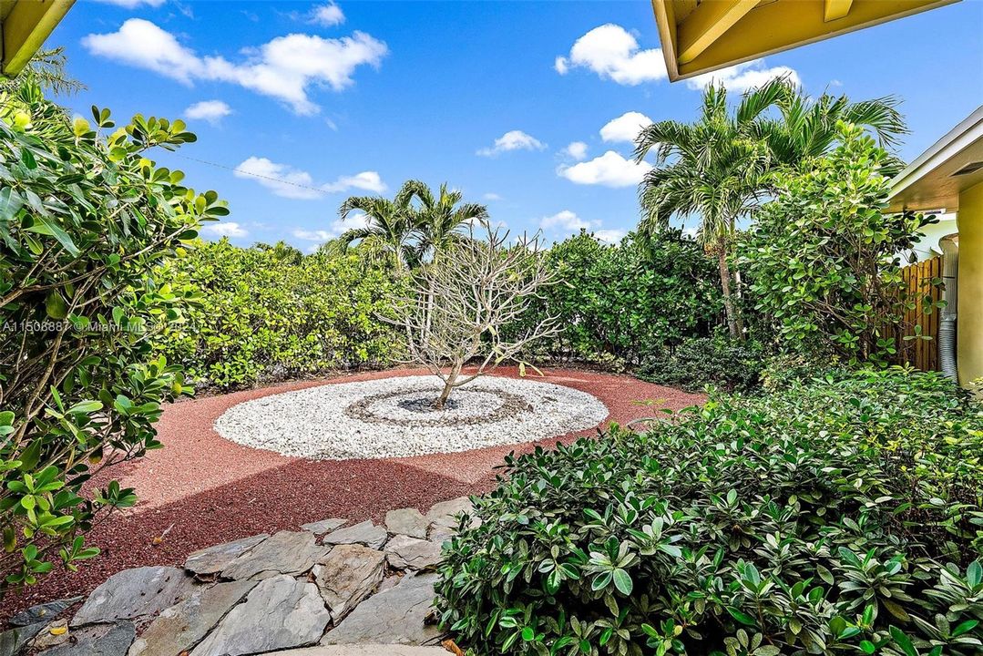 Private front yard with low maintenance landscaping.