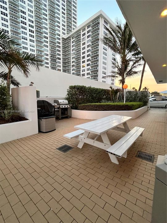 BBQ area on deck pool next to clubhouse