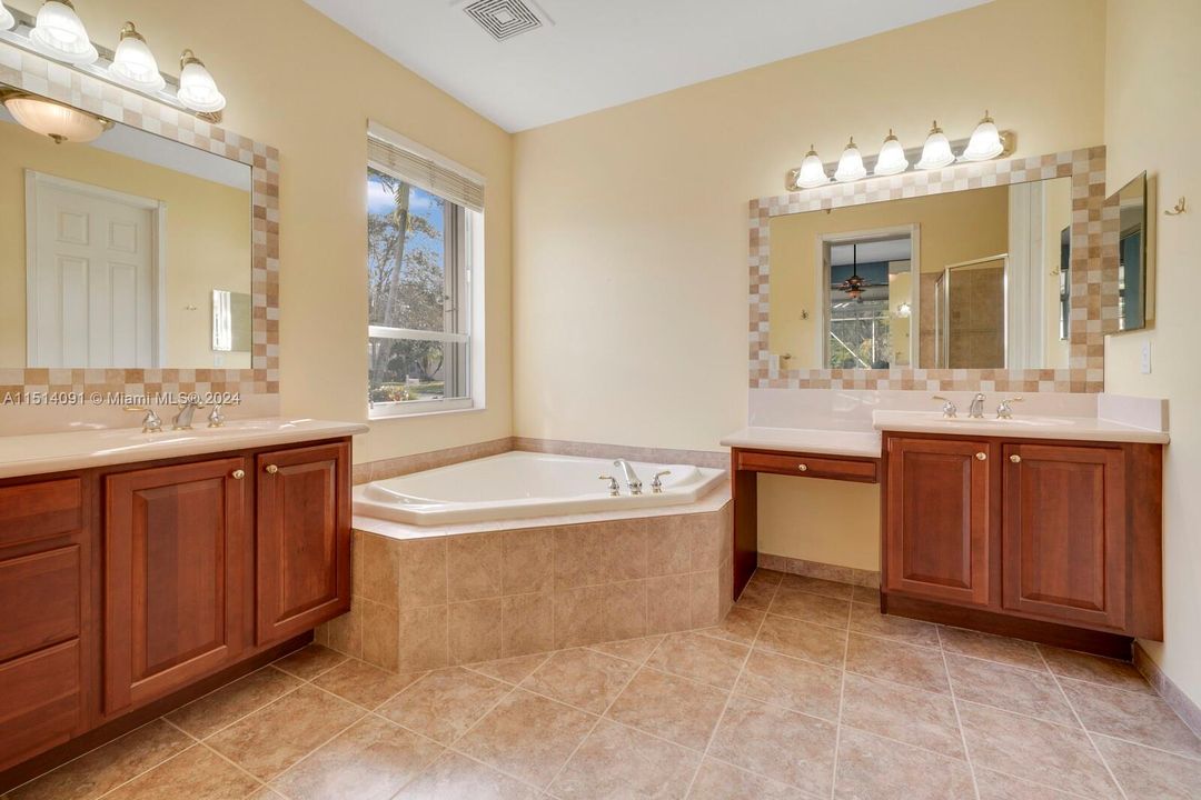 Dual vanities, sunken tub, large walk in shower, seperate water closet