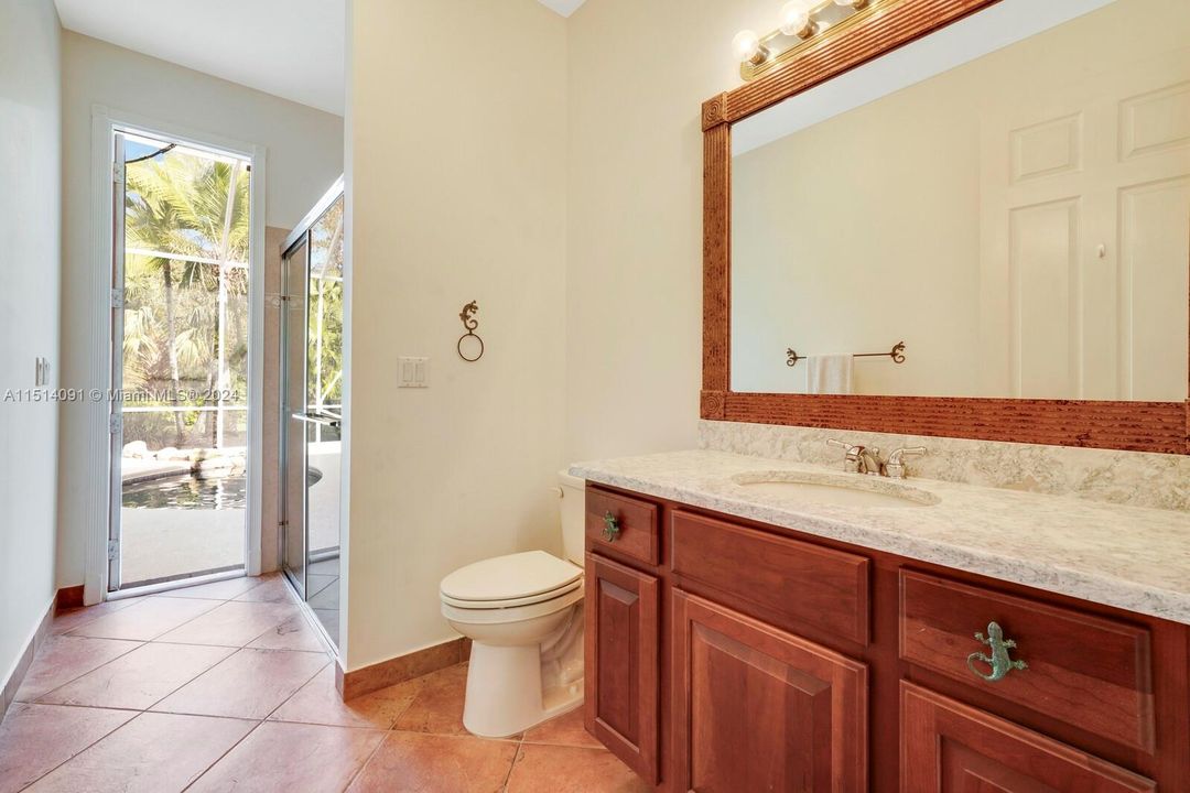 Cabana full bath with doorway to pool area