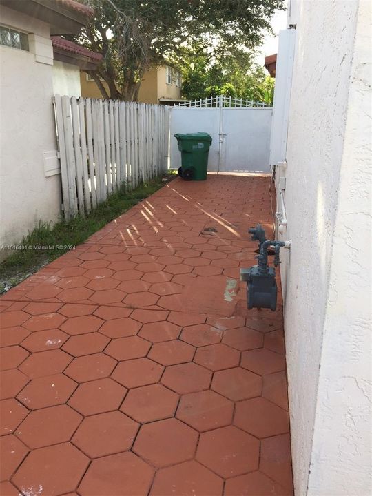 PAVED GATED BACK YARD