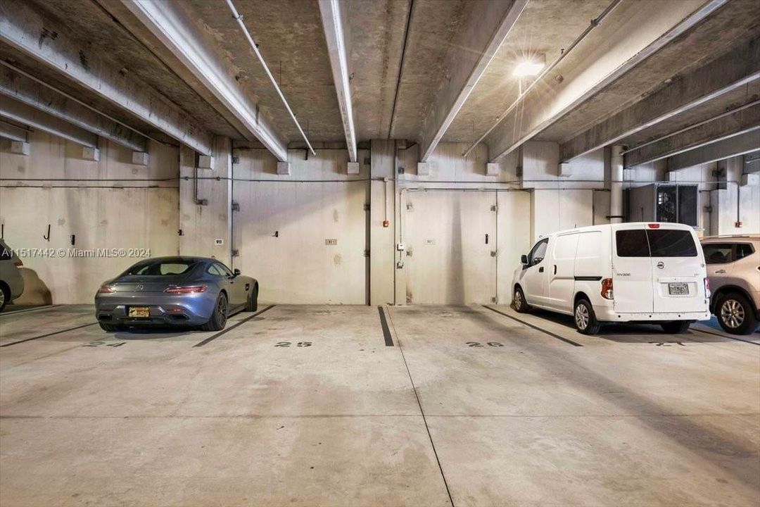 two side by side deeded spaces, with outlets for electric vehicle charging