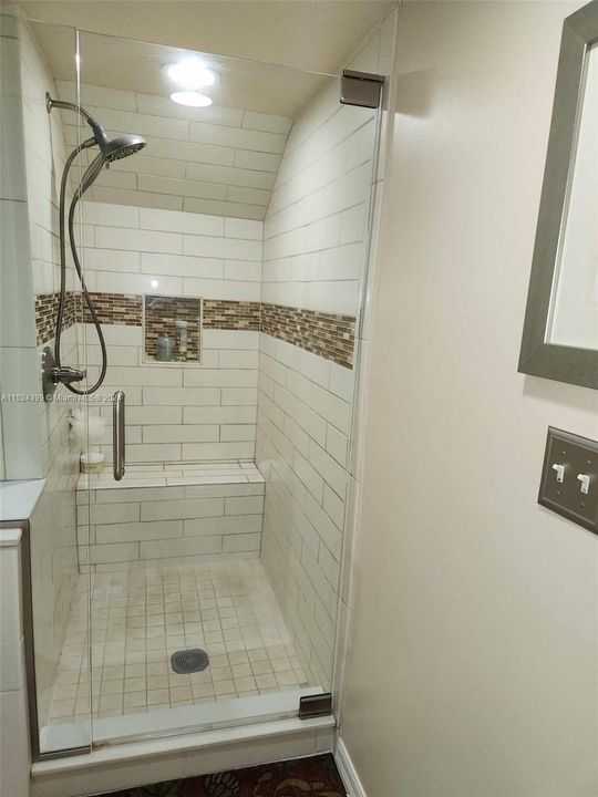 Walk in shower with bench beautifully renovated