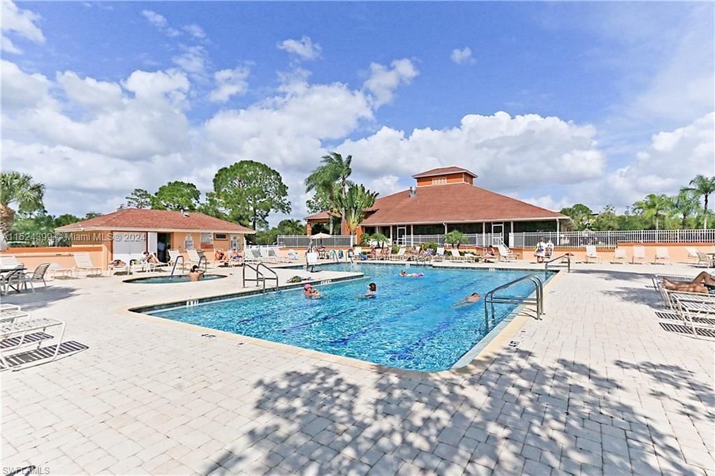 Large pool and pool deck attached to club house