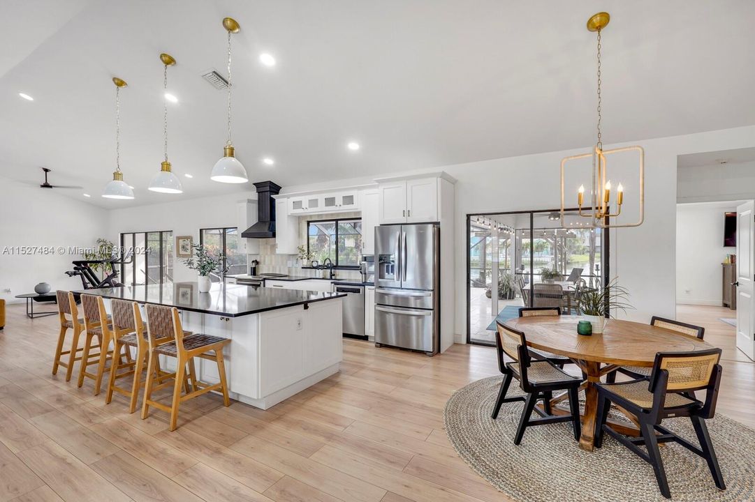 Kitchen view of island and dining area.