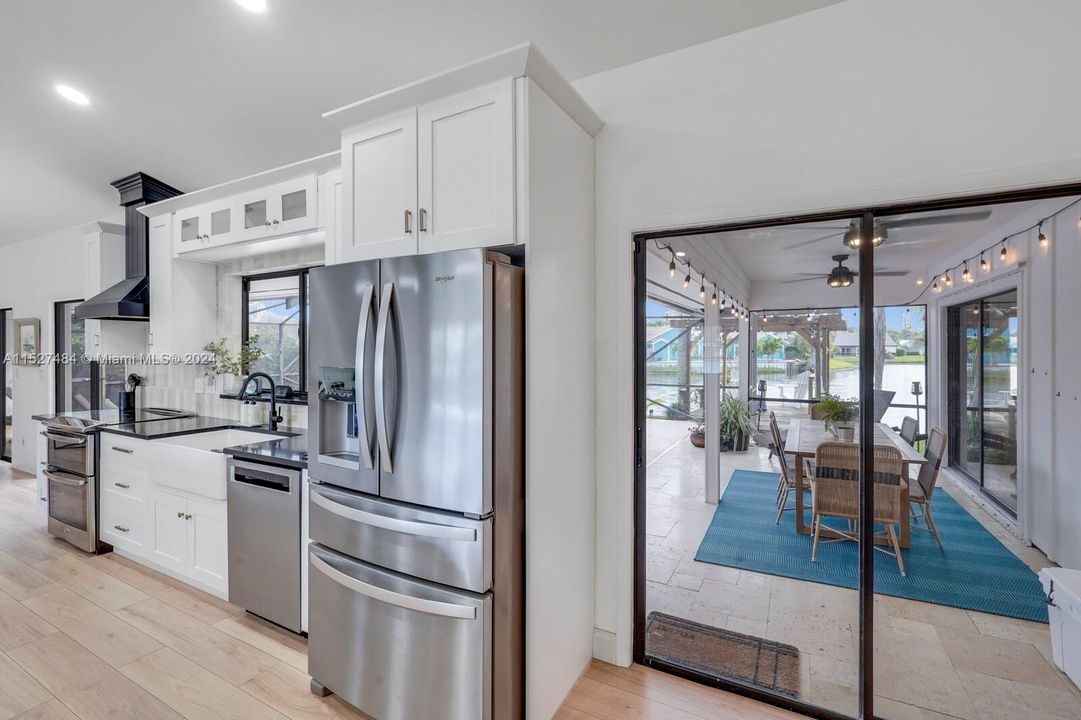 Kitchen view of patio and pool area