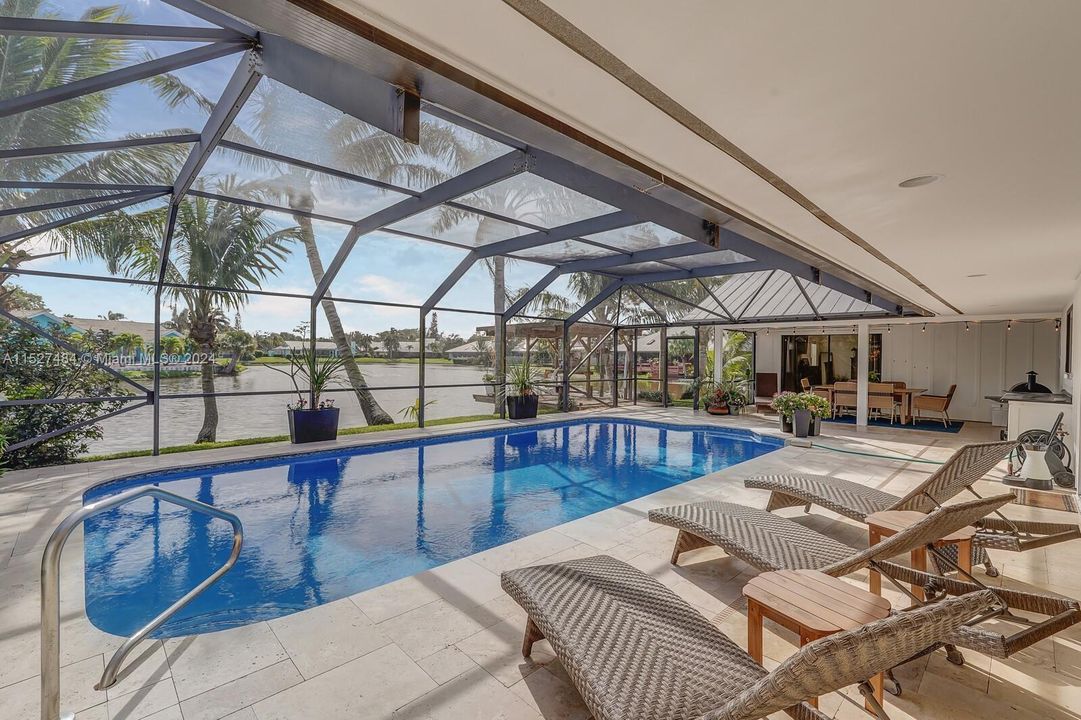 Pool and travertine deck, covered and screen-in