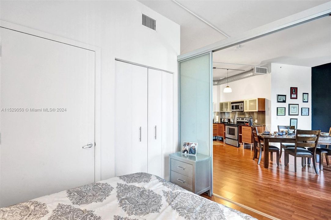 The bedroom has sliding opaque doors for added privacy.