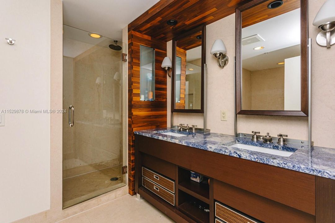 Vanity with dual sinks, separate shower, tub and private toilet with bidet set.